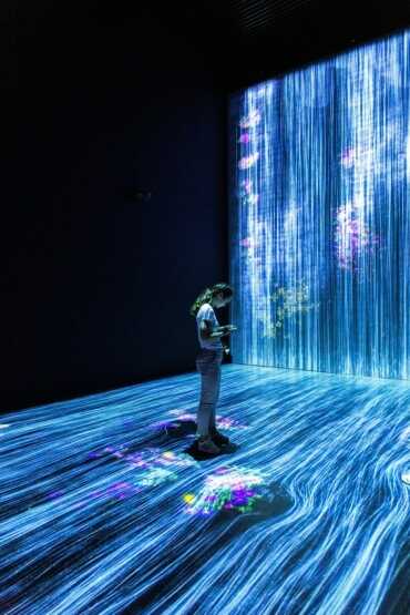 person using mobile in futuristic room